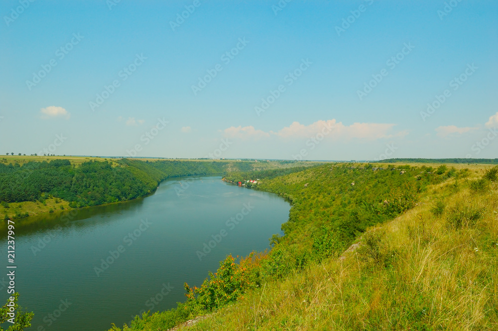 landscape with green hills and river