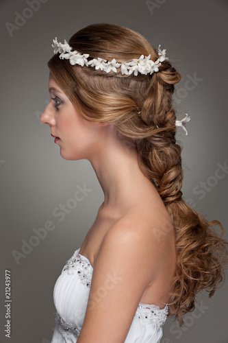 sideview of beautiful woman with small flowers