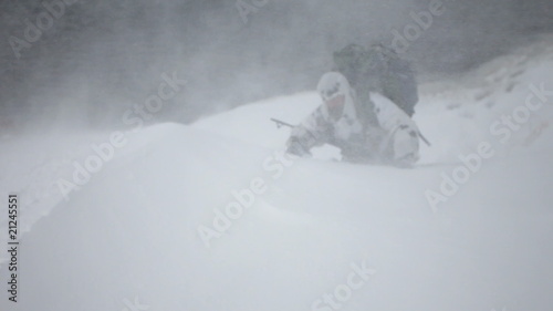 man with a backpack. A blizzard.