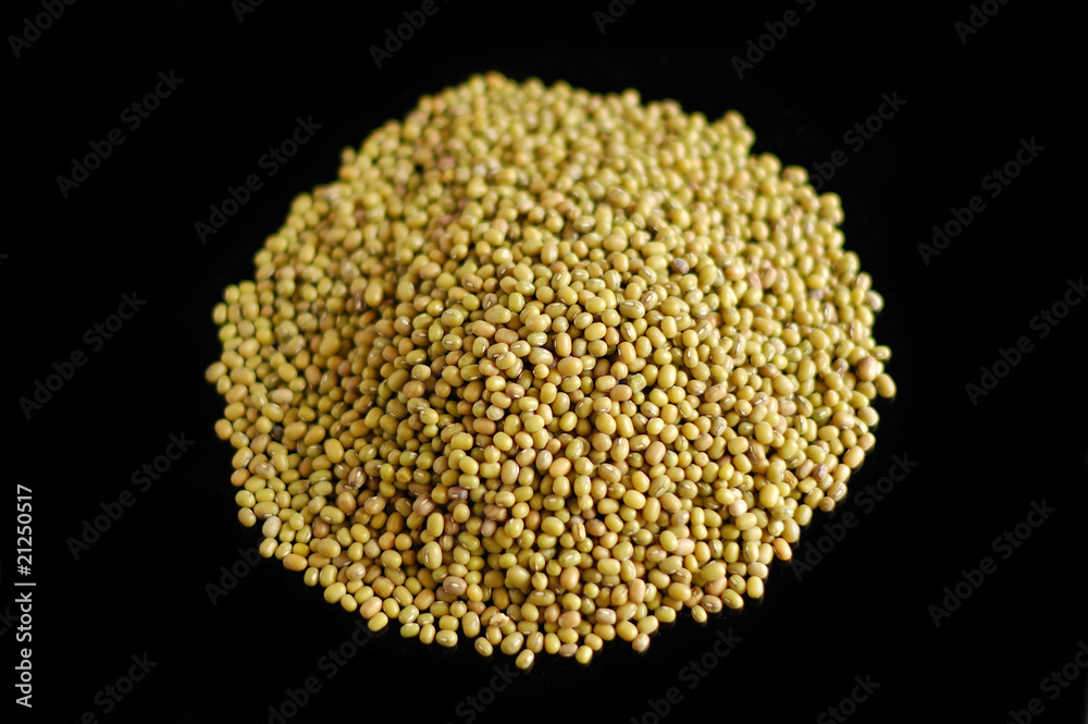 Golden gram against black background Golden gram against black background