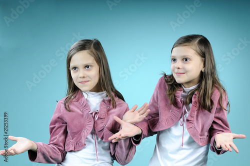 twin girls talking and communicating photo