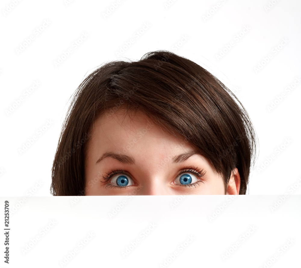 partially hidden face with big blue eyes partially hidden face with big blue eyes
