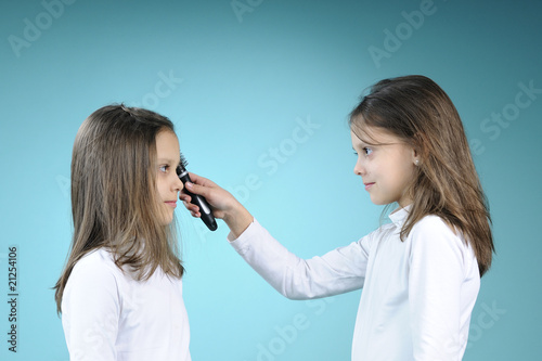 white twin brushing her sisters hair