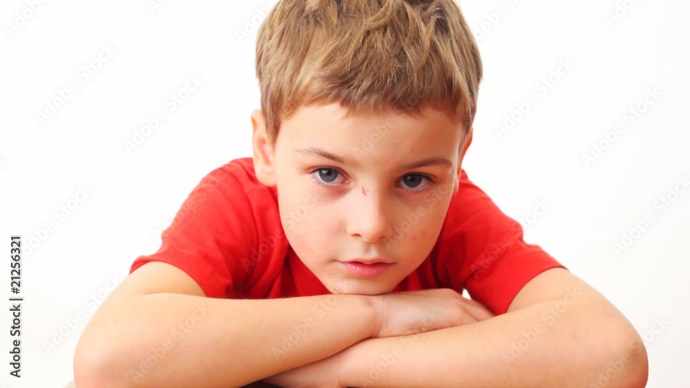 face small boy in red t-shirt close up on white background face small boy in red t-shirt close up on white background