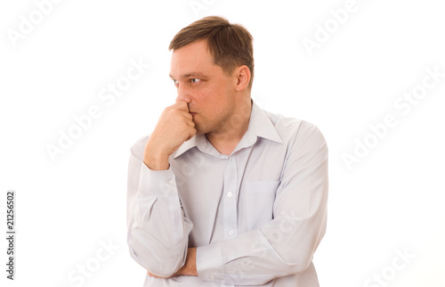disgruntled man in a blue shirt standing on a white background © Privilege