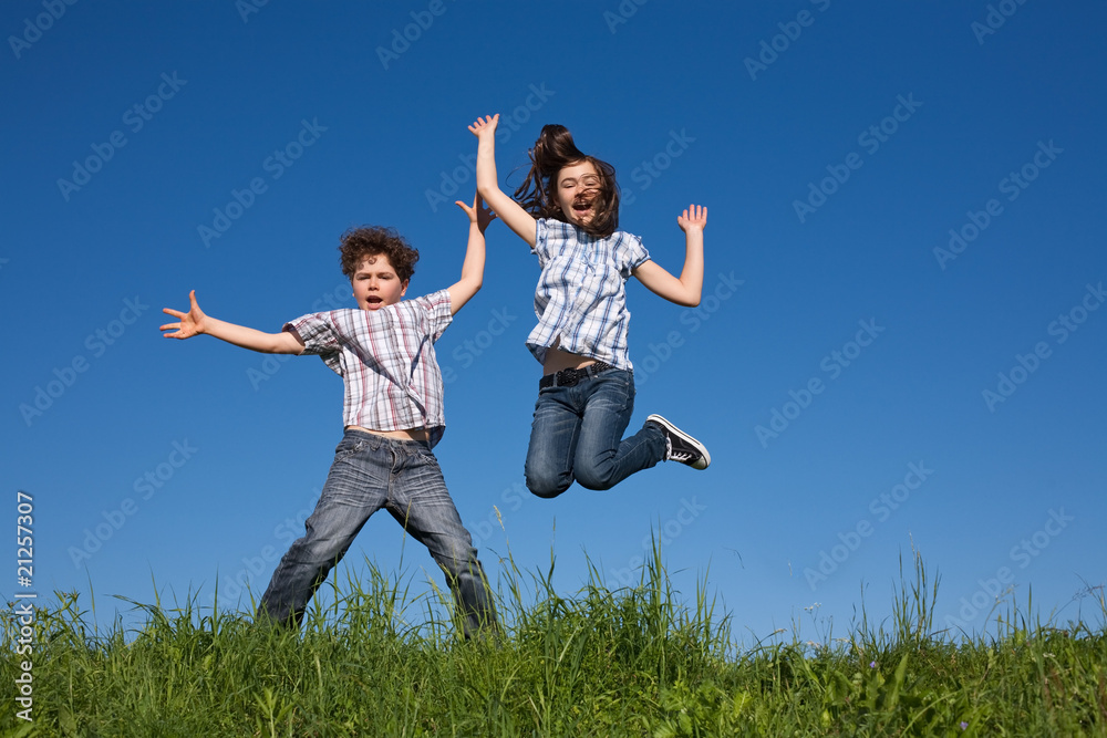 Girl and boy jumping, running outdoor Girl and boy jumping, running outdoor