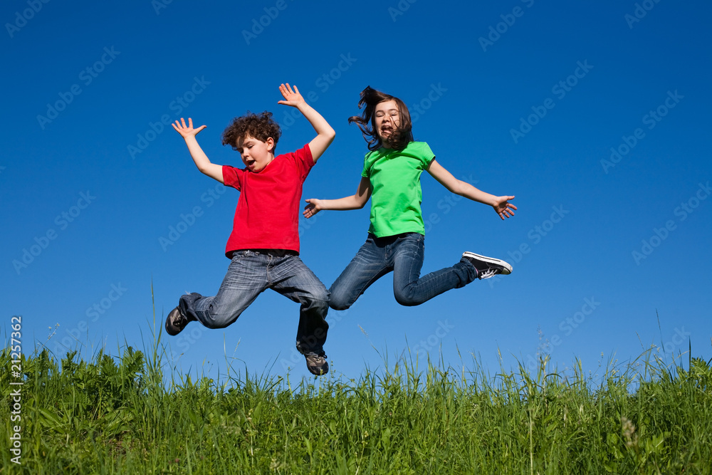 Girl and boy jumping, running outdoor Girl and boy jumping, running outdoor