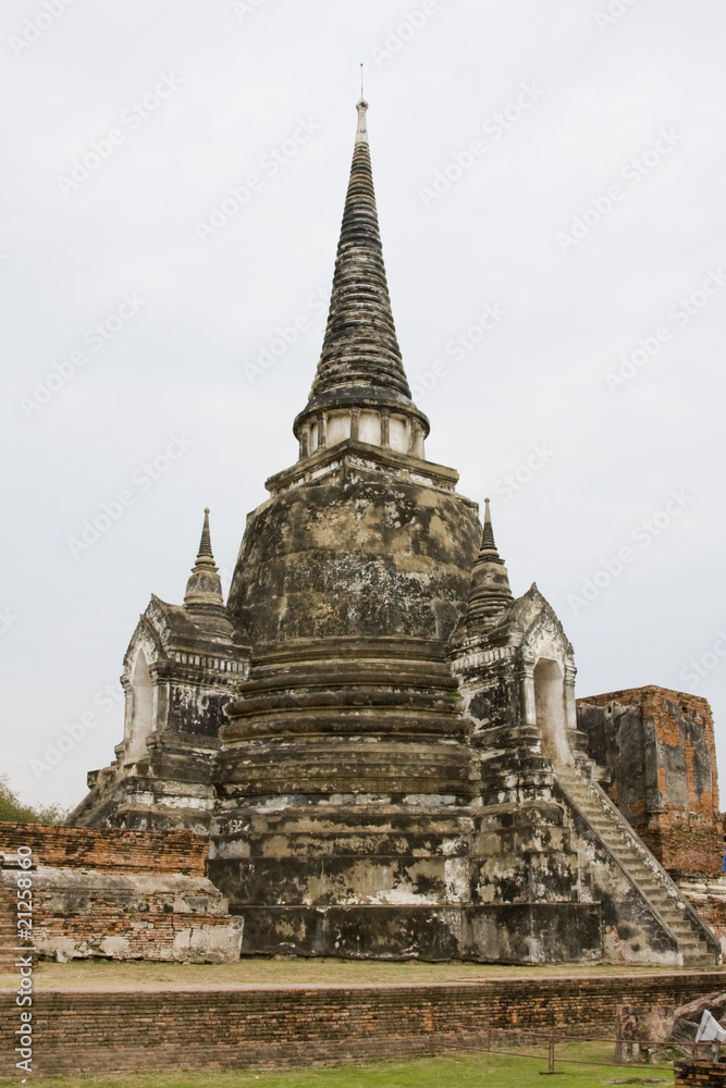 Old stone buddhist stupa in Ayutthaya, Thailand.