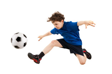Boy playing football isolated on white background