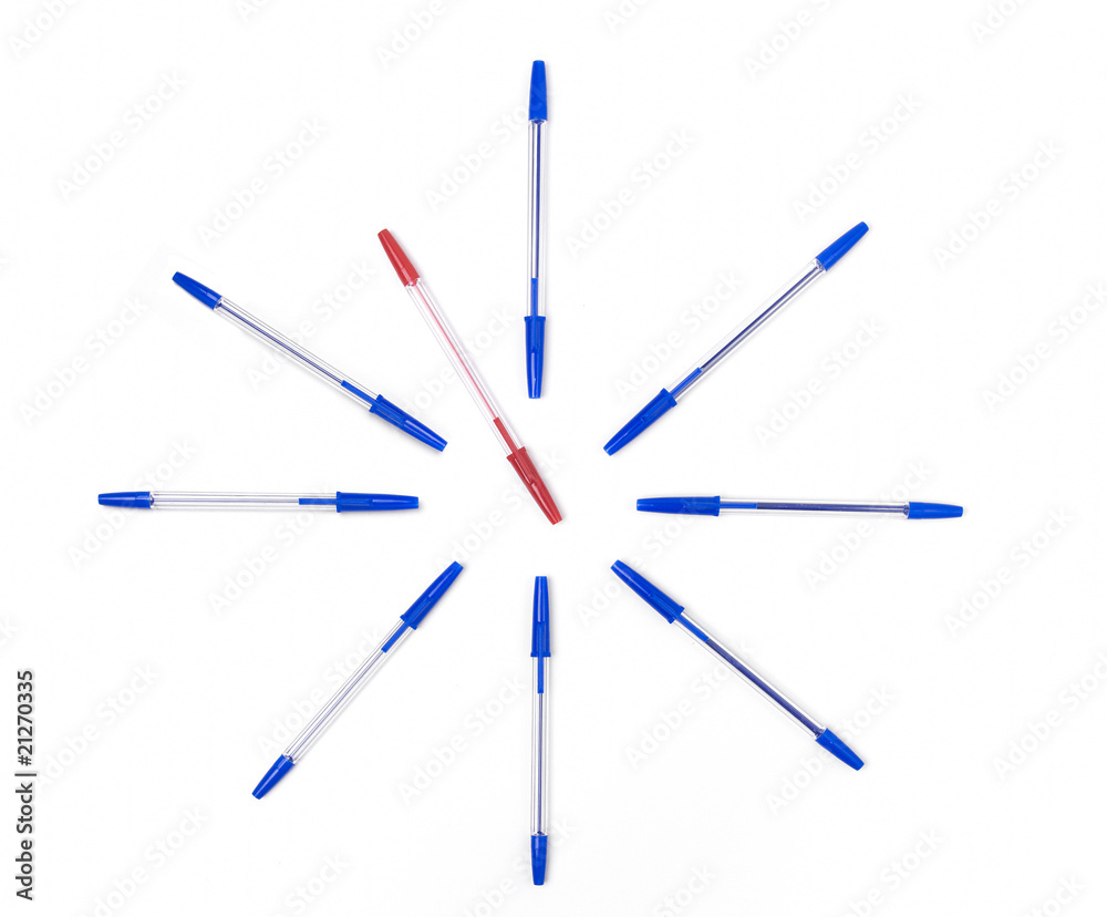Clock set on white background by pens