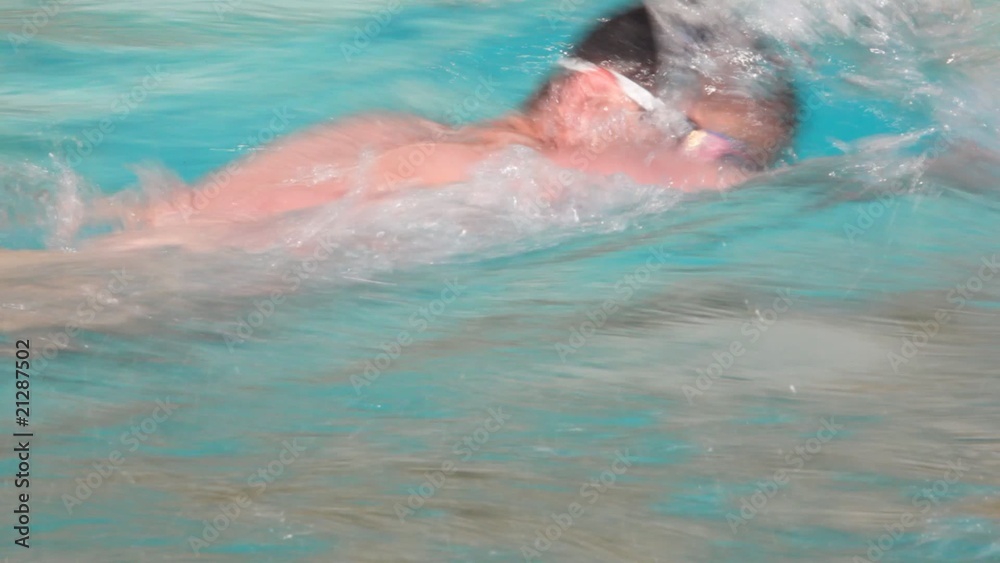 swimmer men with goggles swimming in waterpool with blue water swimmer men with goggles swimming in waterpool with blue water