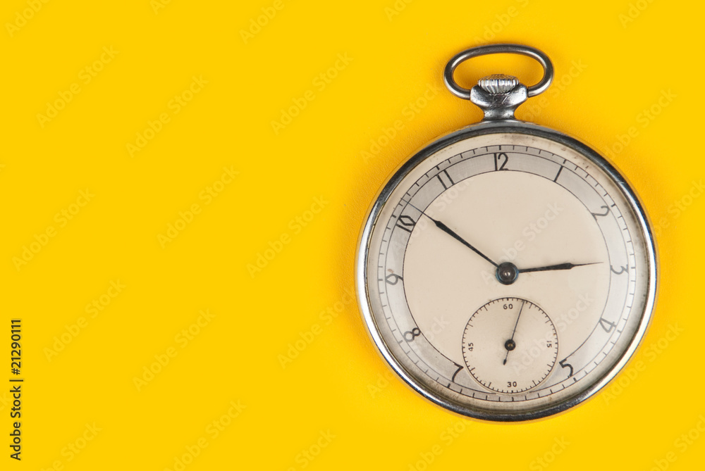 old clock isolated on a yellow background old clock isolated on a yellow background
