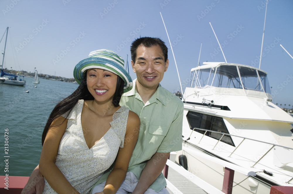 couple near yacht in marina (portrait)