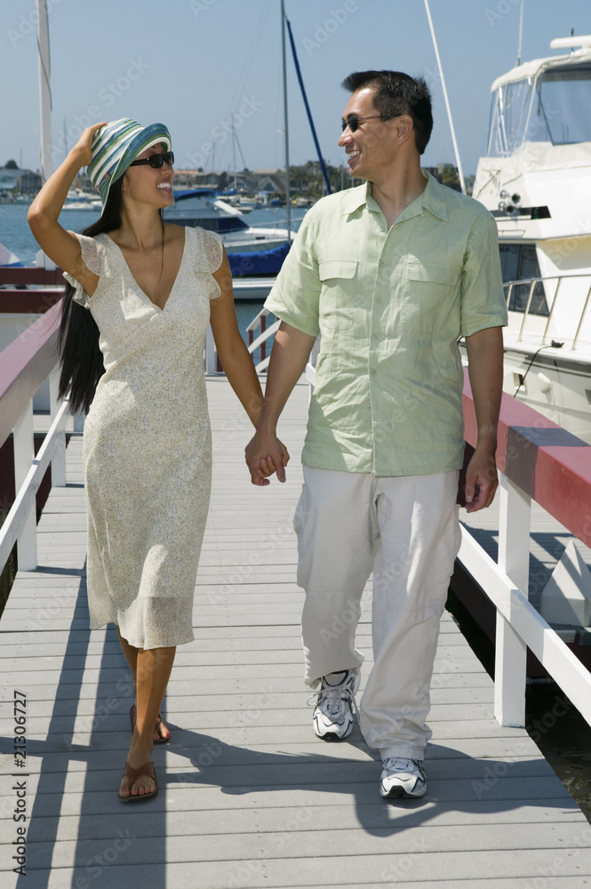 couple walking on dock