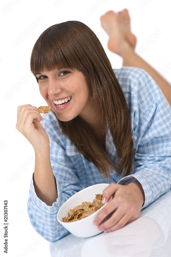 Female teenager eat healthy cereal for breakfast Female teenager eat healthy cereal for breakfast