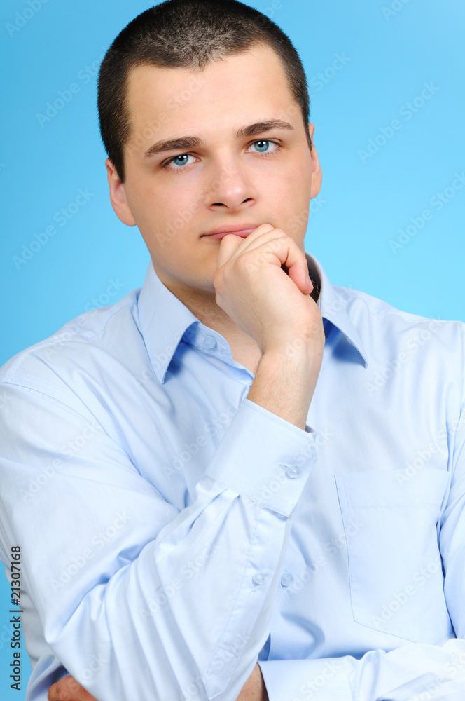Portrait of a businessman on blue background Portrait of a businessman on blue background