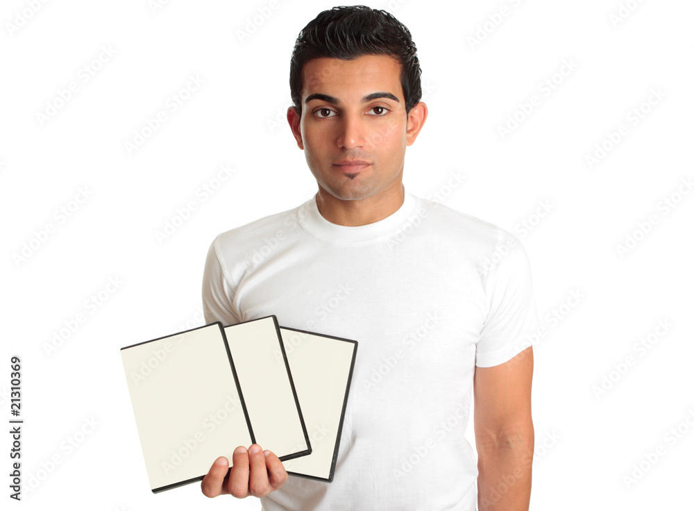 Man holding set DVD movies or games in his hand Man holding set DVD movies or games in his hand