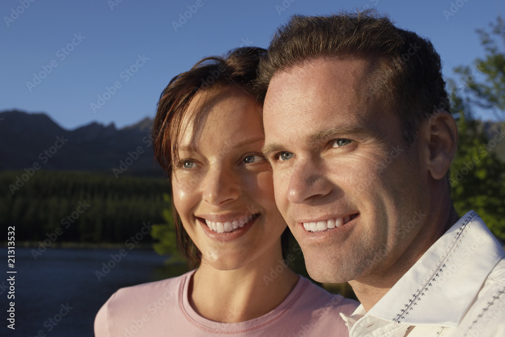 Obraz premium couple outdoors by lake.