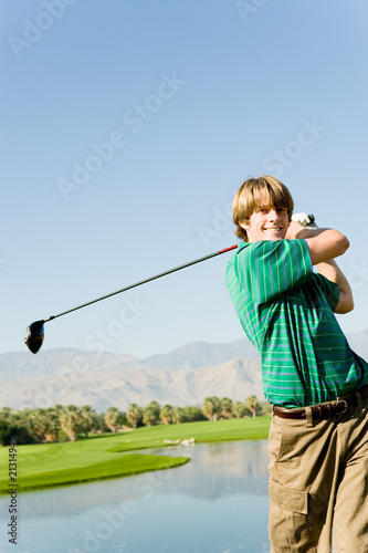 golfer swinging club