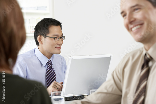 Businessman Using Laptop in Office