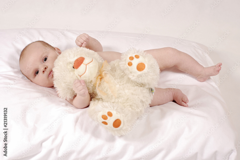 baby with a furry teddy bear