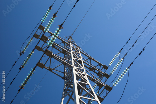 Metal electric pole on a blue sky background
