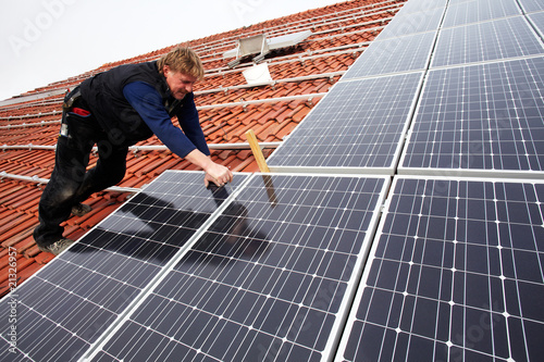 installing solar modules on a roof 11