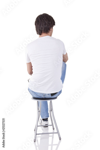 man sitting on a bench in back