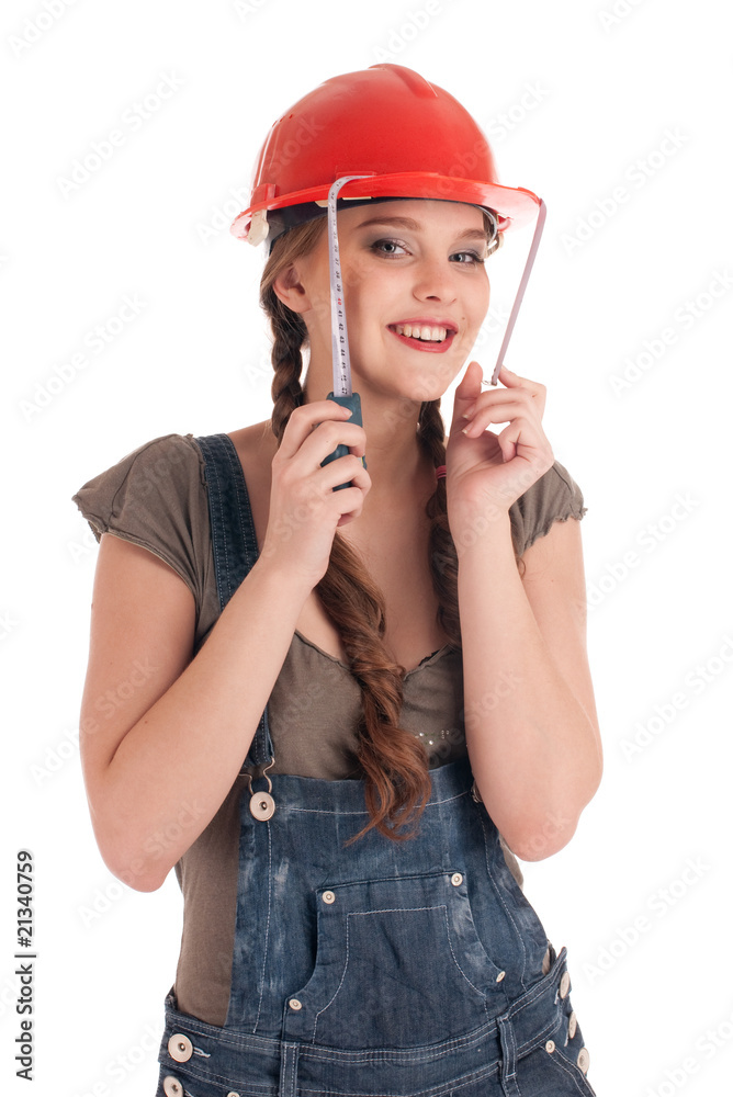 Young playful worker woman holding tape measure Young playful worker woman holding tape measure