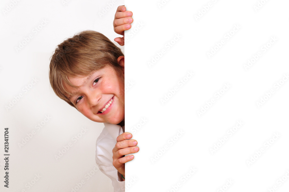 Cute boy behind white board.