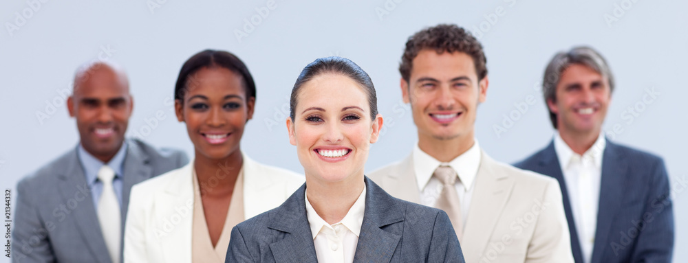 Multi-ethnic business team standing Multi-ethnic business team standing