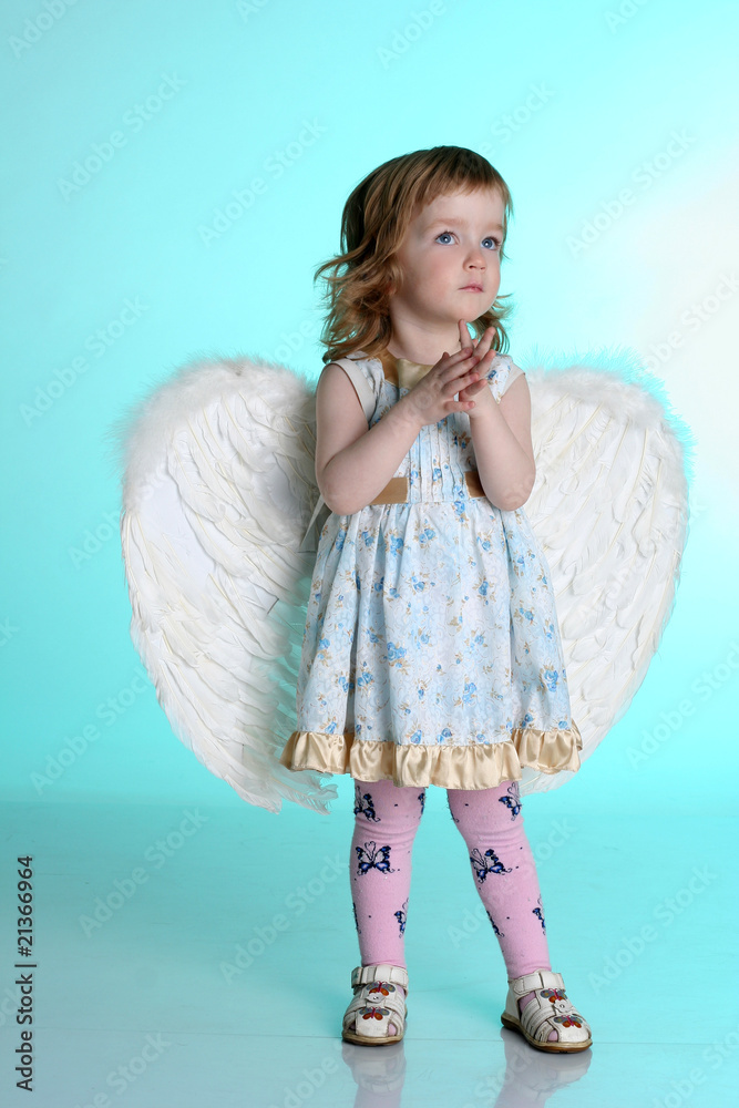 A little (three year old) girl with angel wings A little (three year old) girl with angel wings