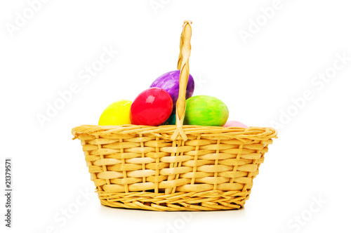 Easter concept with eggs and basket on white