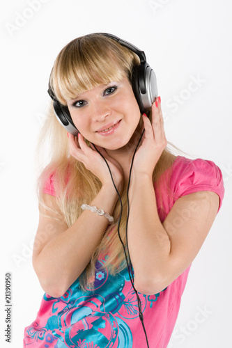 blonde girl with headphones on white