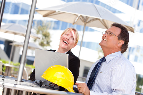 Businesswoman and Man Laugh...
