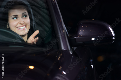 young pretty woman driving car