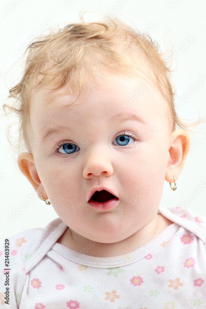 Blond curly baby with blue eyes and mouth open Blond curly baby with blue eyes and mouth open