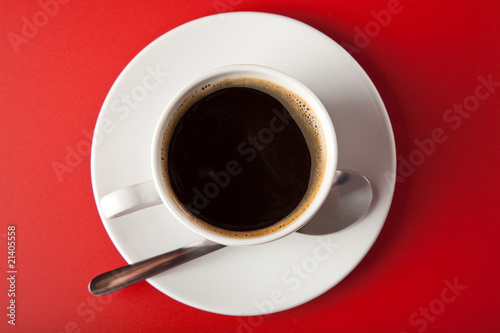 cup of coffee over red background