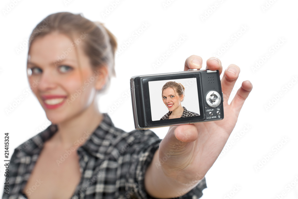 blonde girl taking a photo of herself with a digital camera