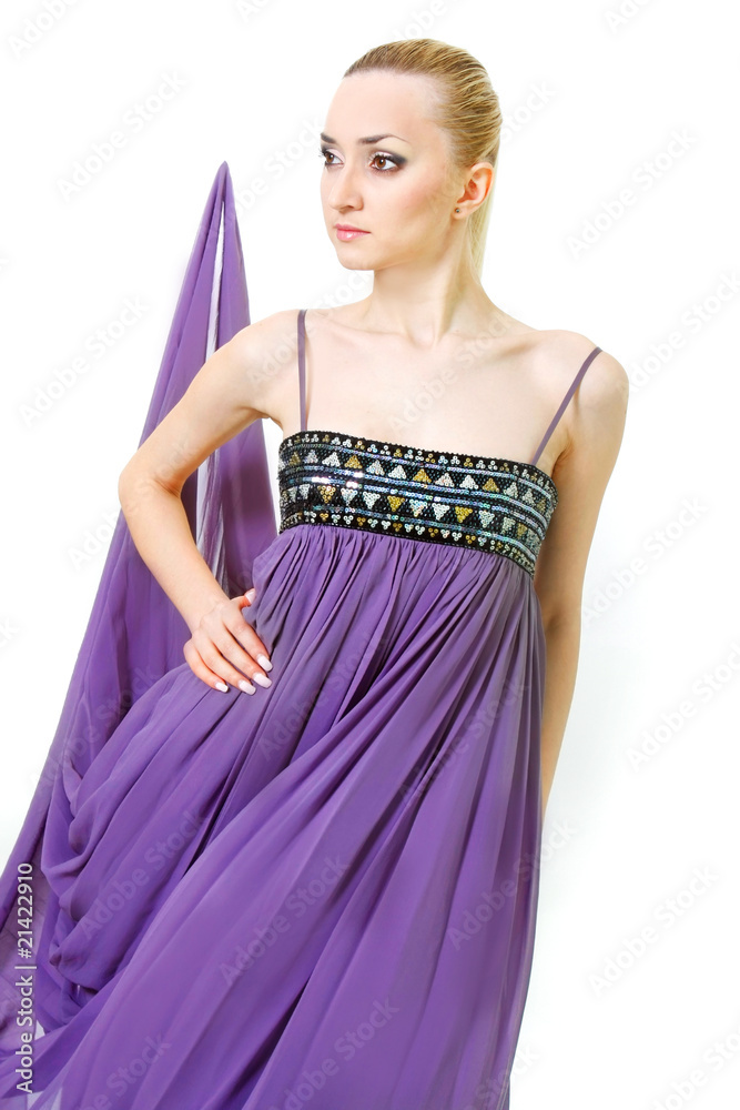 studio portrait of beautiful woman in purple dress