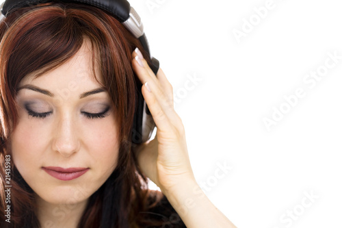 Woman with headphones isolated high key portrait