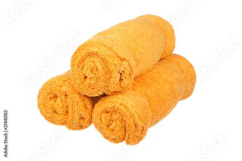 Three orange towels rolls