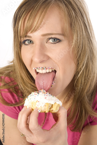 woman licking a pastry