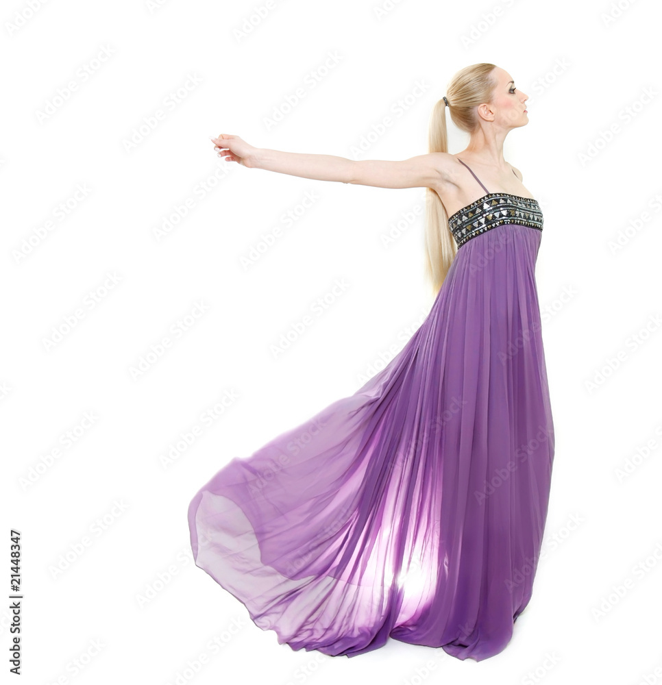 studio shot of beautiful woman in long purple dress studio shot of beautiful woman in long purple dress