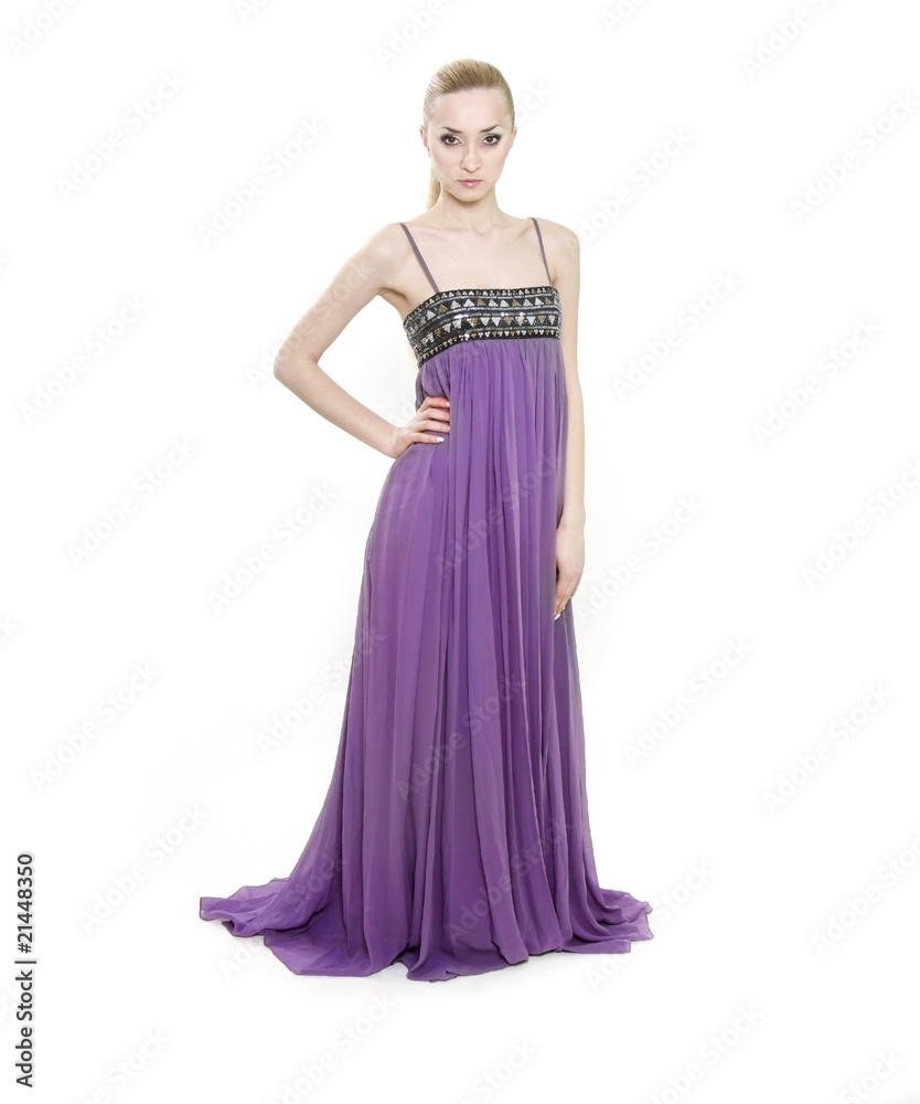 studio shot of young beautiful woman in long purple dress studio shot of young beautiful woman in long purple dress