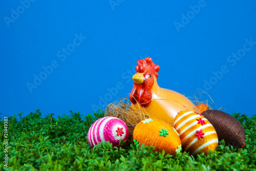 Easter eggs and hen on cress photo