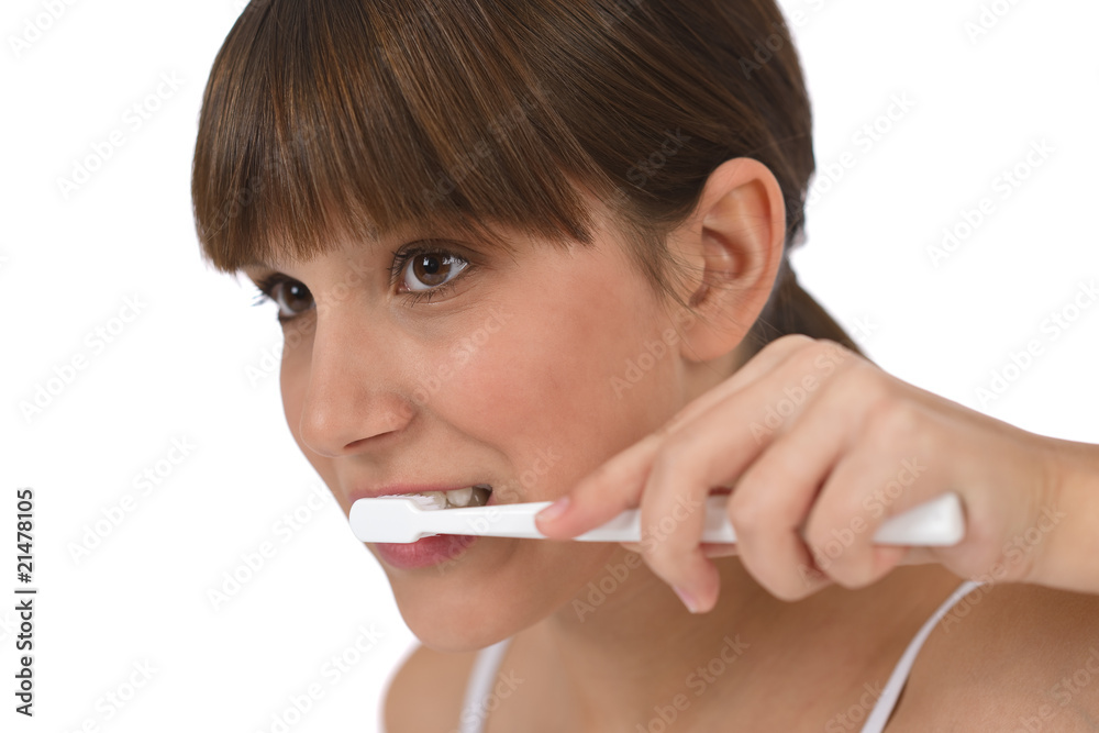 Body care - Female teenager brushing teeth Body care - Female teenager brushing teeth