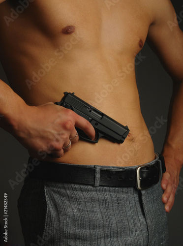 man torso with gun in hands