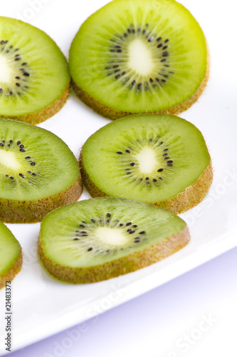 Kiwi slices on white plate