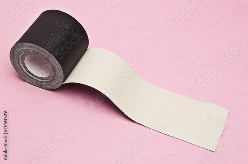 Fotografija Black gaffers tape on a pink background.